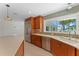 Open-concept kitchen with stainless steel appliances and a view of the waterfront at 11050 7Th E St, Treasure Island, FL 33706