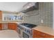 Well-equipped kitchen featuring a professional-grade range and custom cabinetry at 11050 7Th E St, Treasure Island, FL 33706