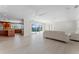 Bright and airy living room with access to the kitchen and pool area at 11050 7Th E St, Treasure Island, FL 33706