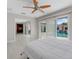 Main bedroom with pool view, ensuite bath, and walk-in closet at 11050 7Th E St, Treasure Island, FL 33706