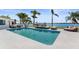 Backyard pool with water views and lounge chairs at 11050 7Th E St, Treasure Island, FL 33706