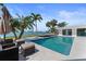 Inviting backyard pool with ample seating and water views at 11050 7Th E St, Treasure Island, FL 33706