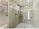 Elegant tiled shower with dual shower heads at 11050 7Th E St, Treasure Island, FL 33706