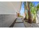 Beautiful landscaping beside the home with stepping stones, mulch, and tropical plants at 11050 7Th E St, Treasure Island, FL 33706