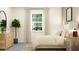 Serene bedroom with neutral tones, a comfortable bed, wooden dresser, and a plant to add nature at 11821 Sparkling Topaz Cv, Parrish, FL 34219