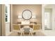 Modern office space with a minimalist desk, comfortable seating, and a large mirror adding to the room's appeal at 11821 Sparkling Topaz Cv, Parrish, FL 34219