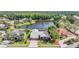 Aerial view of house in a gated community with a lake view at 1307 Forestedge Blvd, Oldsmar, FL 34677
