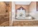 Elegant bathroom with a soaking tub and a separate glass-enclosed shower at 1307 Forestedge Blvd, Oldsmar, FL 34677