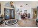 The foyer leads into a dining area featuring an elegant chandelier and a beautifully decorated doorway at 1307 Forestedge Blvd, Oldsmar, FL 34677