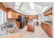 Bright kitchen features granite counters, an island, recessed lighting and stainless steel appliances at 1307 Forestedge Blvd, Oldsmar, FL 34677
