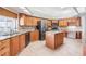 Spacious kitchen boasts granite countertops, an island, stainless appliances and lots of cabinet space at 1307 Forestedge Blvd, Oldsmar, FL 34677