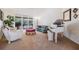 A cozy living room featuring plush seating, a grand piano, and sliding doors leading to an outdoor patio at 1307 Forestedge Blvd, Oldsmar, FL 34677