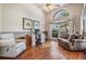 Comfortable living room featuring a large window, high ceilings and stylish furnishings at 1307 Forestedge Blvd, Oldsmar, FL 34677