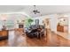 Comfortable living room with fireplace, hardwood floors, and vaulted ceilings at 1307 Forestedge Blvd, Oldsmar, FL 34677