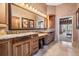 Main bathroom featuring double sinks, granite countertops, and a luxurious vanity area at 1307 Forestedge Blvd, Oldsmar, FL 34677