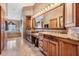 Main bathroom with double vanity, cabinets, and a large mirror at 1307 Forestedge Blvd, Oldsmar, FL 34677