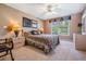 Comfortable primary bedroom featuring calm neutral paint and an eye-catching ceiling fan at 1307 Forestedge Blvd, Oldsmar, FL 34677