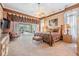 Main bedroom with neutral carpet, a ceiling fan, and a sliding door to the screened in patio at 1307 Forestedge Blvd, Oldsmar, FL 34677