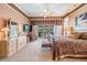 Comfortable main bedroom with large bed, ensuite bathroom, and walk-out access to pool area at 1307 Forestedge Blvd, Oldsmar, FL 34677