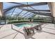 A screened-in pool and patio offer a private oasis for relaxation and entertaining, perfect for enjoying outdoor living at 1307 Forestedge Blvd, Oldsmar, FL 34677