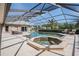 Beautiful pool area with covered lanai, spa, and lounging space for relaxing and entertaining at 1307 Forestedge Blvd, Oldsmar, FL 34677