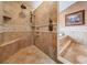Luxurious walk-in shower with dual shower heads and a built-in bench at 1307 Forestedge Blvd, Oldsmar, FL 34677