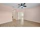 Spacious bedroom features a ceiling fan, wood flooring and ample space at 13611 Circa Crossing Dr, Lithia, FL 33547
