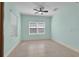 Spacious bedroom with tile floors, large windows, and neutral paint, ready for customization at 13611 Circa Crossing Dr, Lithia, FL 33547