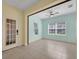 Bright bedroom with natural light, featuring tile flooring and a ceiling fan at 13611 Circa Crossing Dr, Lithia, FL 33547