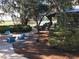 Inviting outdoor seating area with a fire pit and relaxing views of the lake at 13611 Circa Crossing Dr, Lithia, FL 33547