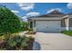Charming one-story home with a two-car garage and well-manicured landscaping at 13611 Circa Crossing Dr, Lithia, FL 33547