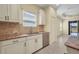 Bright kitchen featuring granite countertops, stainless steel appliances, and tile flooring at 13611 Circa Crossing Dr, Lithia, FL 33547