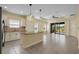 Spacious kitchen and living area with granite countertops, stainless steel appliances, and tile floors at 13611 Circa Crossing Dr, Lithia, FL 33547