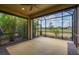 Screened lanai offers scenic views of the backyard and surrounding greenery at 13611 Circa Crossing Dr, Lithia, FL 33547