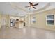 Open-concept kitchen and living room area with stainless appliances and tile flooring at 13611 Circa Crossing Dr, Lithia, FL 33547