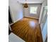 Bright bedroom with hardwood flooring and natural light at 1417 W Curlew Pl, Tarpon Springs, FL 34689