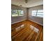 Cozy bedroom with shiny hardwood flooring and natural light at 1417 W Curlew Pl, Tarpon Springs, FL 34689