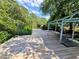 Spacious wooden dock featuring a covered gazebo, perfect for enjoying waterfront views and outdoor gatherings at 1417 W Curlew Pl, Tarpon Springs, FL 34689