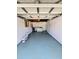 A spacious garage featuring a laundry area with a washer and dryer, offering convenience and functionality at 1417 W Curlew Pl, Tarpon Springs, FL 34689