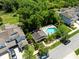 High-angle view showcasing a pool, surrounded by trees and neighborhood homes at 14616 Rocky Brook Dr, Tampa, FL 33625