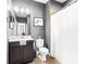 Bathroom featuring a vanity with a framed mirror, a white shower curtain, and tiled floors at 14616 Rocky Brook Dr, Tampa, FL 33625