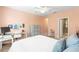 Bedroom featuring natural light, neutral walls, ceiling fan, carpet flooring, and a desk at 14616 Rocky Brook Dr, Tampa, FL 33625