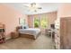 Bedroom featuring natural light, neutral walls, ceiling fan, carpet flooring, and a desk at 14616 Rocky Brook Dr, Tampa, FL 33625