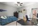 Bedroom featuring neutral walls, carpet flooring, ceiling fan, with a view to an adjoining bathroom at 14616 Rocky Brook Dr, Tampa, FL 33625