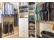 Walk-in closet with custom shelving and plenty of storage space for clothing and accessories at 14616 Rocky Brook Dr, Tampa, FL 33625