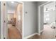 Hallway leading to bedrooms with neutral walls and carpet flooring at 14616 Rocky Brook Dr, Tampa, FL 33625