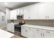 Well-appointed kitchen with modern appliances, ample counter space and decorative backsplash at 14616 Rocky Brook Dr, Tampa, FL 33625