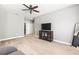 Bright living room with neutral walls, carpet flooring, and a ceiling fan at 14616 Rocky Brook Dr, Tampa, FL 33625