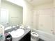Full bathroom featuring a tub and shower combination and granite countertops at 1490 Colt Creek Pl, Wesley Chapel, FL 33543