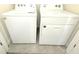 Laundry area features a side-by-side white washer and dryer set at 1490 Colt Creek Pl, Wesley Chapel, FL 33543